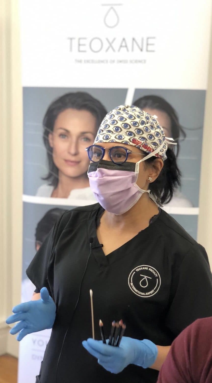 Dr Sabrina Shah-Desai in theatre, in surgical cap