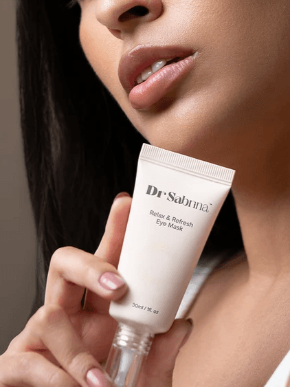 A Dr Sabrina Relax & Refresh Eye Mask tube held in the hand